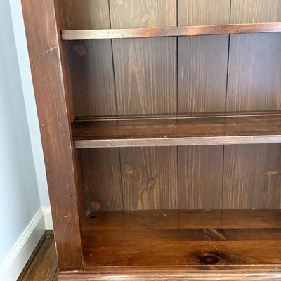 Wood bookshelf with arch detail