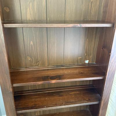 Wood bookshelf with arch detail