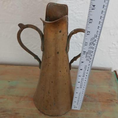 Antique Russian hammered brass copper pitcher beautiful, handcrafted aesthetic typical of Russian metalwork with two beautiful ornate...