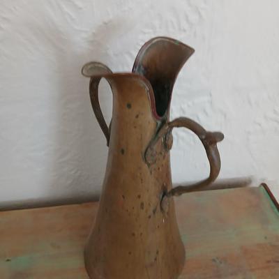 Antique Russian hammered brass copper pitcher beautiful, handcrafted aesthetic typical of Russian metalwork with two beautiful ornate...