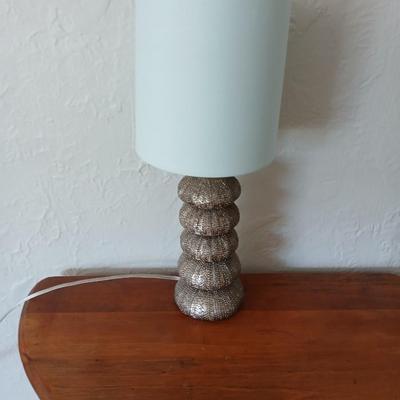 Antique half-round console table with nautical lamp