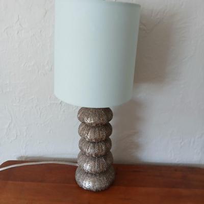 Antique half-round console table with nautical lamp