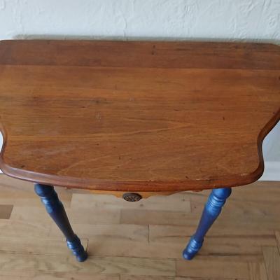 Antique half-round console table with nautical lamp