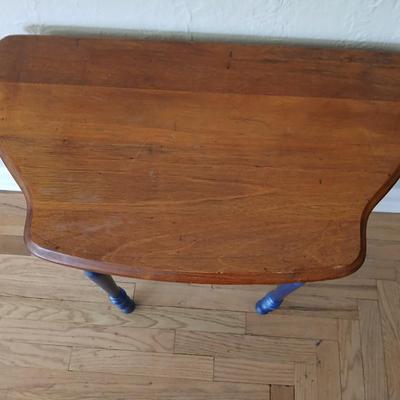 Antique half-round console table with nautical lamp