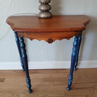 Antique half-round console table with nautical lamp