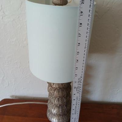 Antique half-round console table with nautical lamp