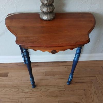 Antique half-round console table with nautical lamp