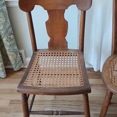 Antique side chairs - cane seats - 1 fiddle back spindle legs - one spindle back with ornate carving