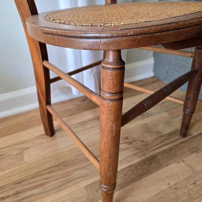 Antique side chairs - cane seats - 1 fiddle back spindle legs - one spindle back with ornate carving
