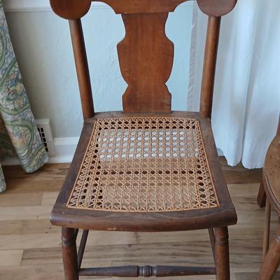 Antique side chairs - cane seats - 1 fiddle back spindle legs - one spindle back with ornate carving