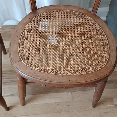 Antique side chairs - cane seats - 1 fiddle back spindle legs - one spindle back with ornate carving