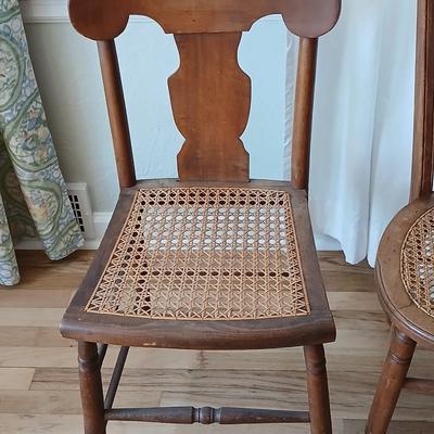 Antique side chairs - cane seats - 1 fiddle back spindle legs - one spindle back with ornate carving