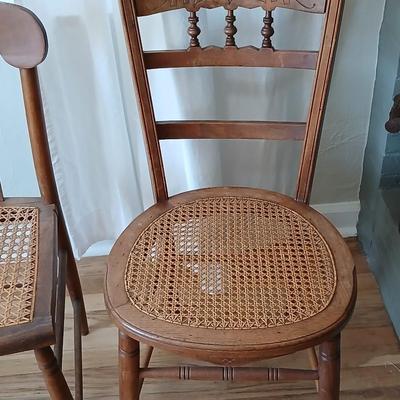Antique side chairs - cane seats - 1 fiddle back spindle legs - one spindle back with ornate carving