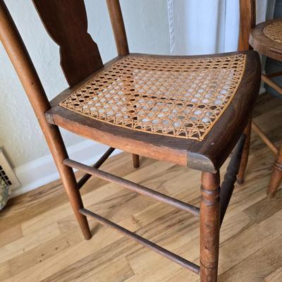Antique side chairs - cane seats - 1 fiddle back spindle legs - one spindle back with ornate carving