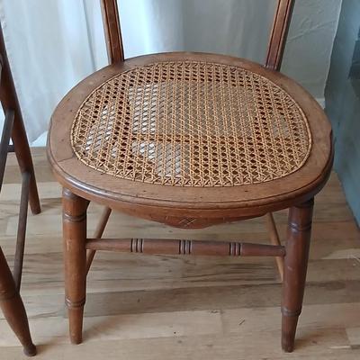 Antique side chairs - cane seats - 1 fiddle back spindle legs - one spindle back with ornate carving