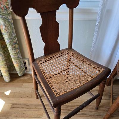 Antique side chairs - cane seats - 1 fiddle back spindle legs - one spindle back with ornate carving