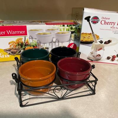Butter warmer, cherry porter and 4 ceramic condiment holder
