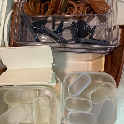Tupperware spice containers in brown and black lids