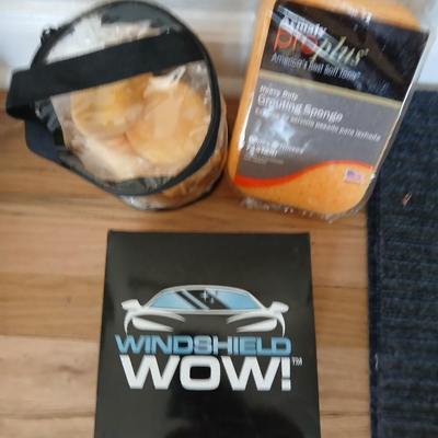 Windshield WOW cloths and sponges and a Ziplock baggie of large sized rubber bands