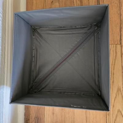 Five Cloth storage baskets and one plastic storage container