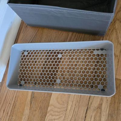 Five Cloth storage baskets and one plastic storage container