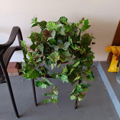 OUTDOOR WICKER CHAIR, SIDE TABLE AND FAUX PLANT
