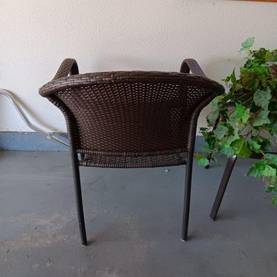 OUTDOOR WICKER CHAIR, SIDE TABLE AND FAUX PLANT