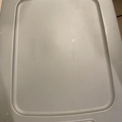Tote full of pans and cookie sheets
