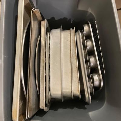 Tote full of pans and cookie sheets