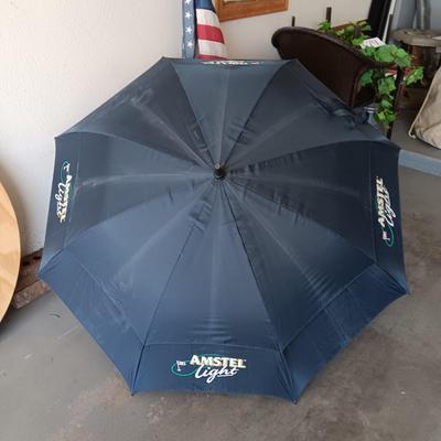 HUGE AMSTEL LIGHT UMBRELLA, US FLAG ON POLE AND A UNC BLEACHER CUSHION