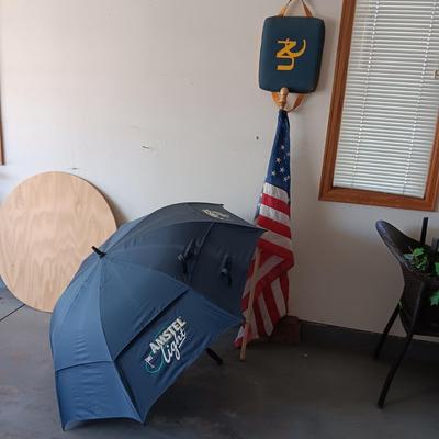 HUGE AMSTEL LIGHT UMBRELLA, US FLAG ON POLE AND A UNC BLEACHER CUSHION