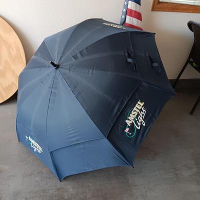 HUGE AMSTEL LIGHT UMBRELLA, US FLAG ON POLE AND A UNC BLEACHER CUSHION