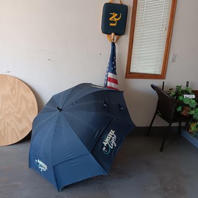 HUGE AMSTEL LIGHT UMBRELLA, US FLAG ON POLE AND A UNC BLEACHER CUSHION