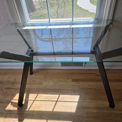 Strut glass topped Dining room / Kitchen table / Desk with black frame legs