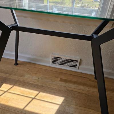 Strut glass topped Dining room / Kitchen table / Desk with black frame legs