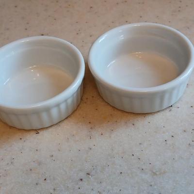 Two lidded ribbed glass storage containers with two small Cordon Bleu sauce dishes