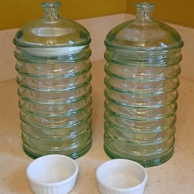 Two lidded ribbed glass storage containers with two small Cordon Bleu sauce dishes
