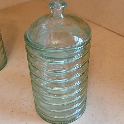 Two lidded ribbed glass storage containers with two small Cordon Bleu sauce dishes