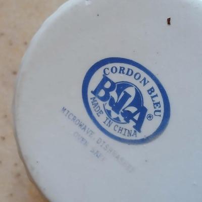 Two lidded ribbed glass storage containers with two small Cordon Bleu sauce dishes