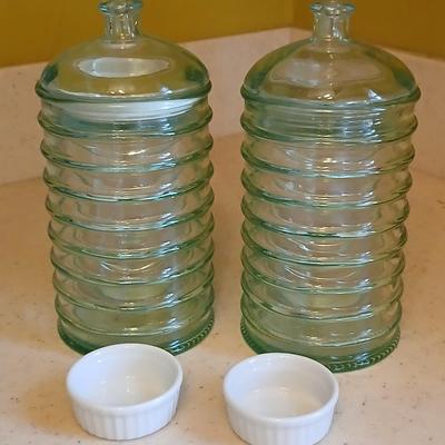 Two lidded ribbed glass storage containers with two small Cordon Bleu sauce dishes