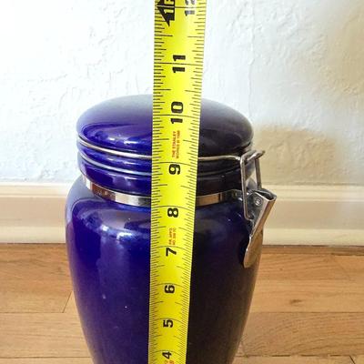 Blue ceramic storage canister and a metal storage box