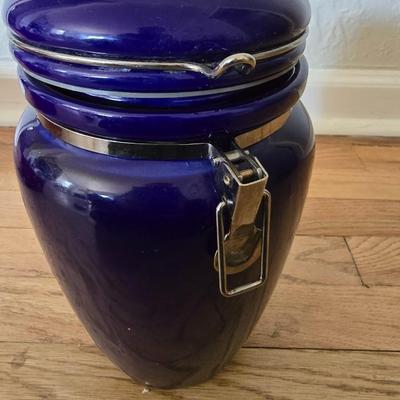 Blue ceramic storage canister and a metal storage box