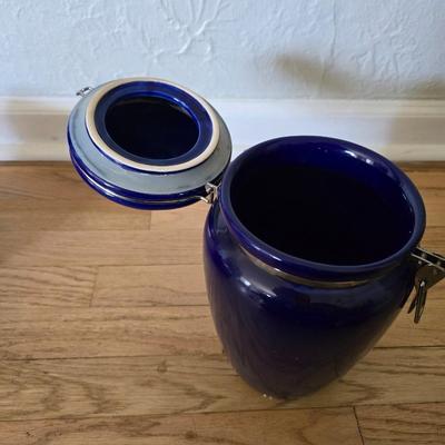 Blue ceramic storage canister and a metal storage box