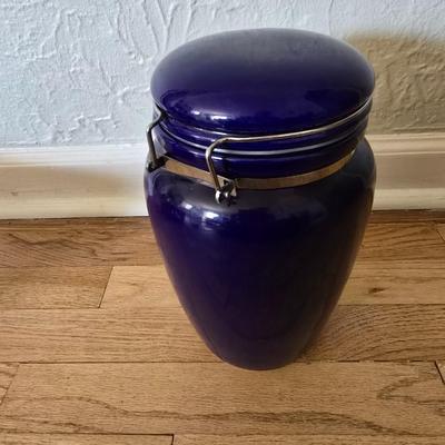 Blue ceramic storage canister and a metal storage box