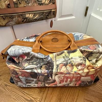 Three fun patterned pieces of luggage