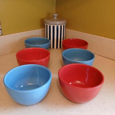6 deep @Home red and blue kitchen bowls with a lidded storage canister