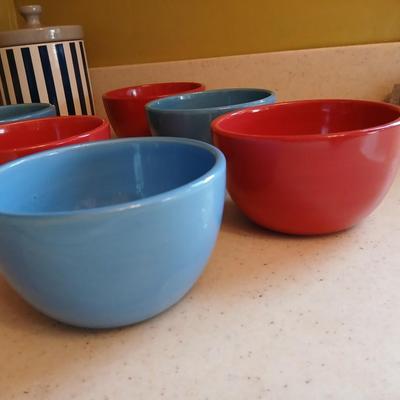 6 deep @Home red and blue kitchen bowls with a lidded storage canister