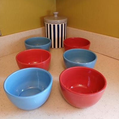 6 deep @Home red and blue kitchen bowls with a lidded storage canister