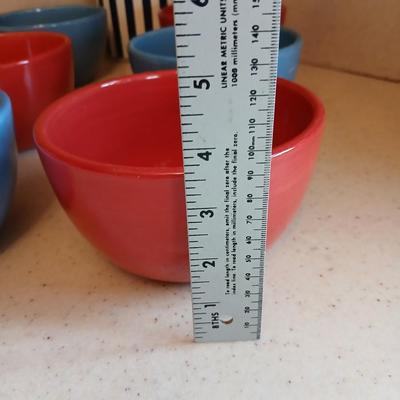 6 deep @Home red and blue kitchen bowls with a lidded storage canister