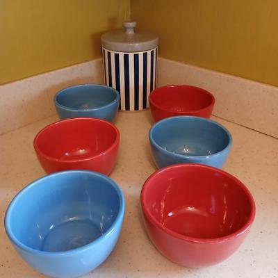 6 deep @Home red and blue kitchen bowls with a lidded storage canister